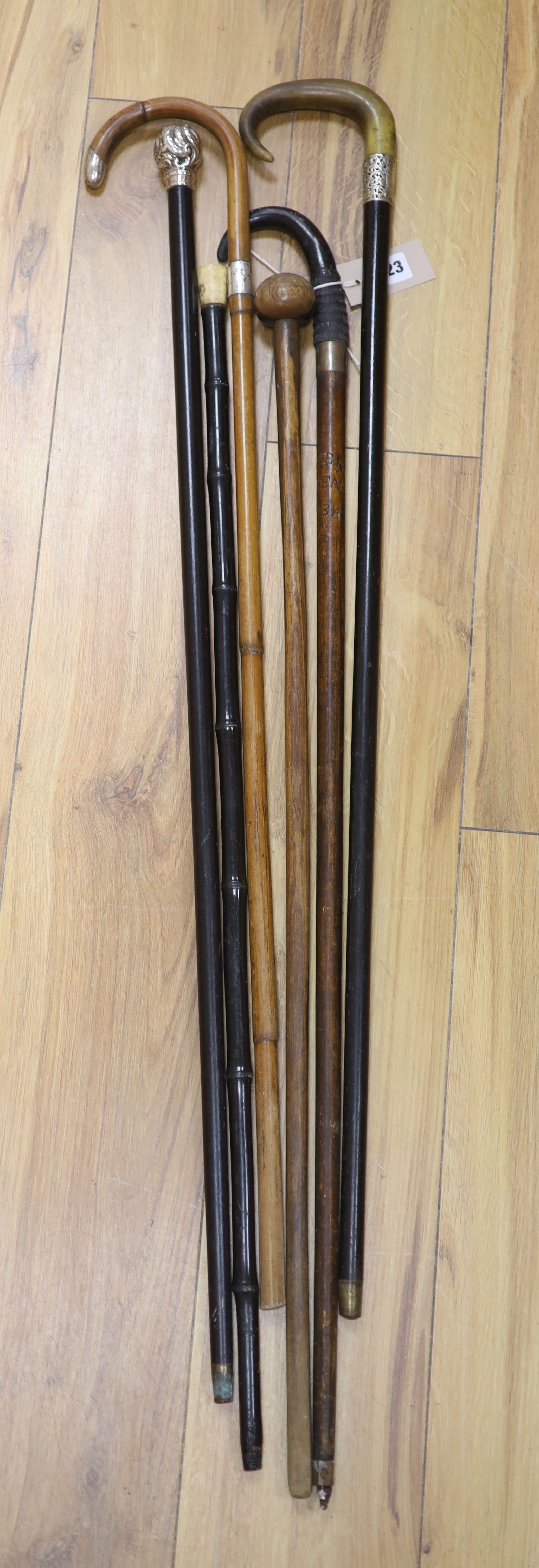 Three silver-mounted sticks and canes and three others